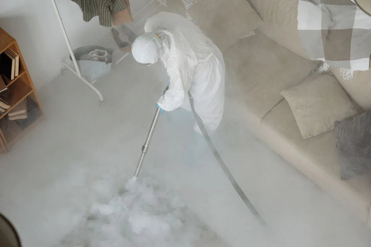 Biohazard cleanup technician in protective equipment, Orange, MA